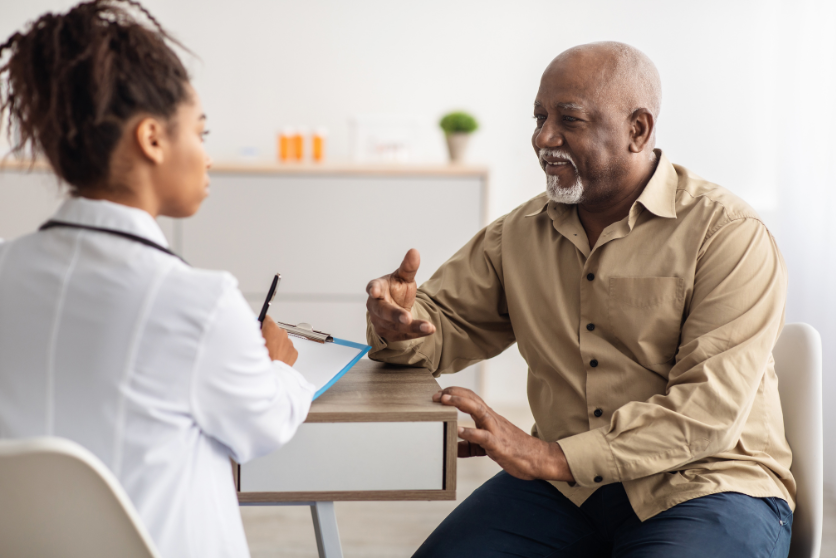 A patient advocating for his health by asking his doctor questions.